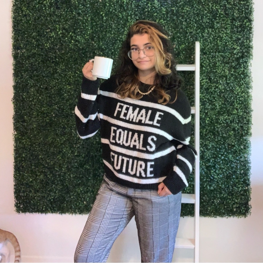 fluffy & comfy “Female Equals Future” black and white striped sweater from H&M